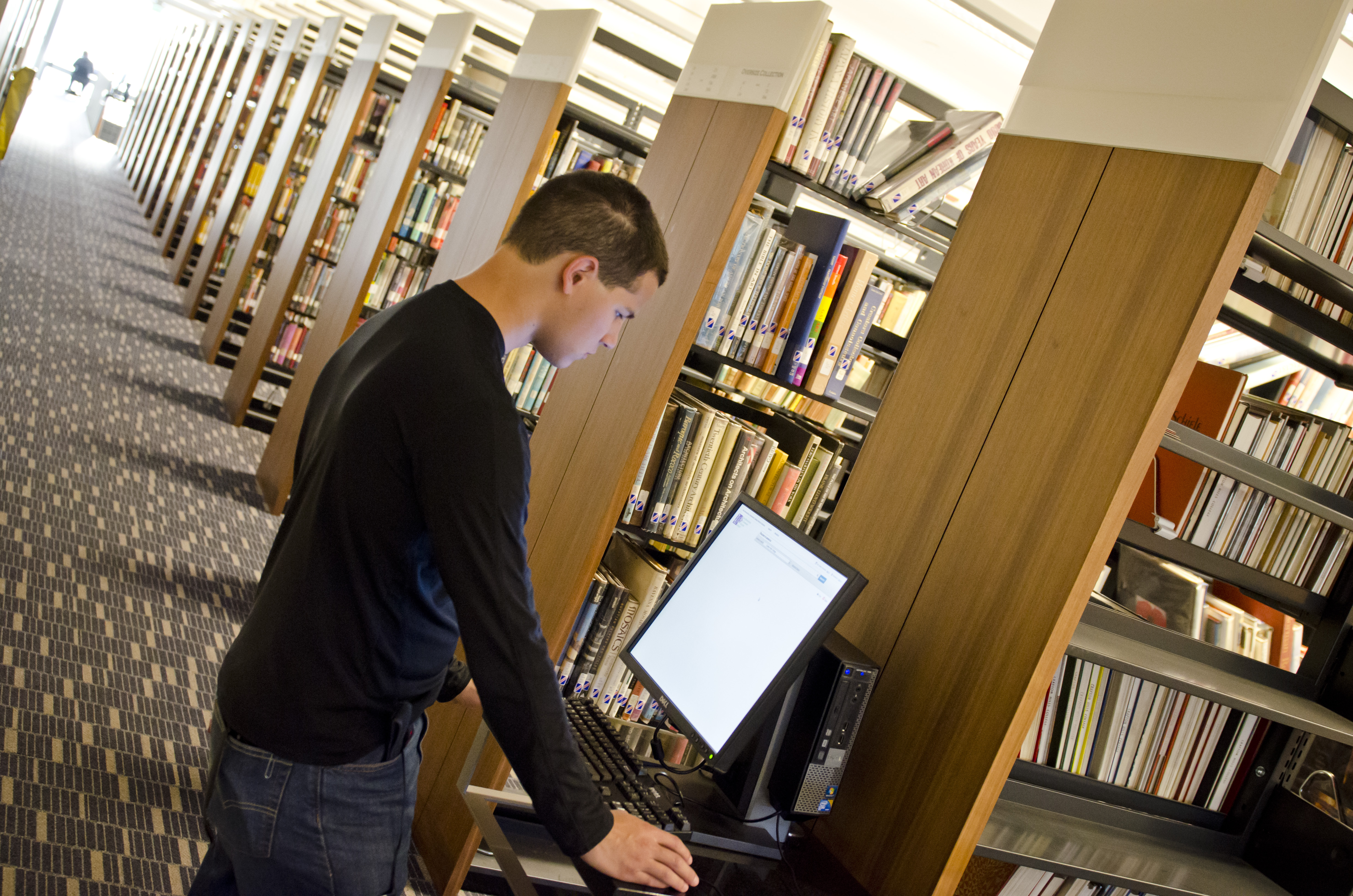 A student using a computer in the library.